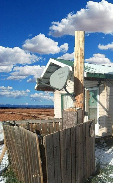 satellite dish on power pole