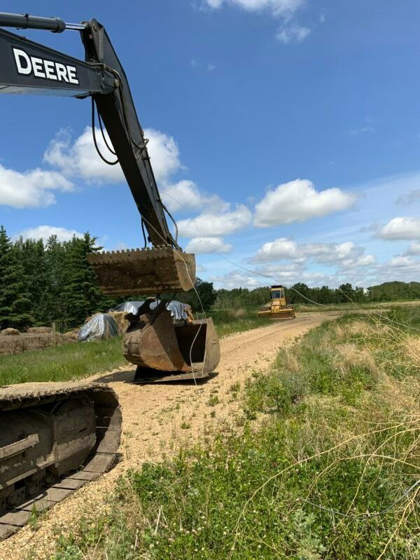 power lines tangled on backhoe